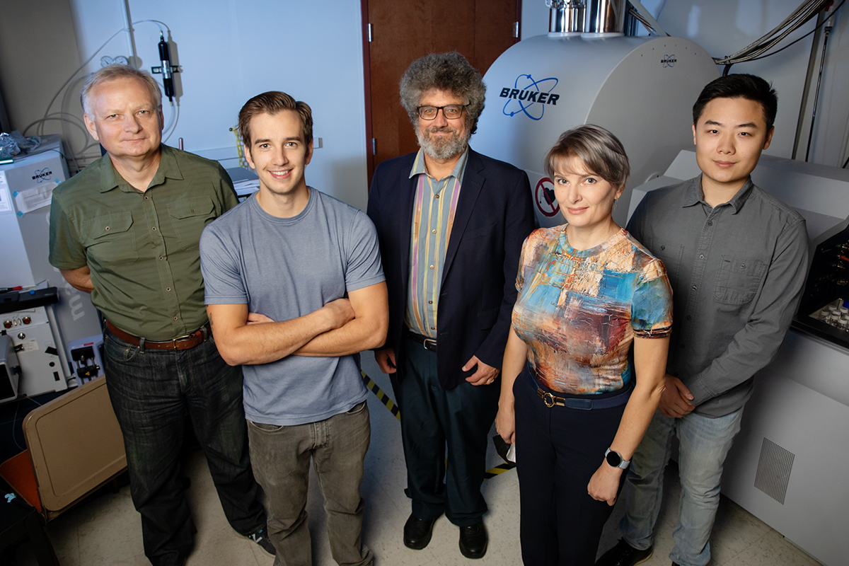 Researchers standing side by side in a lab