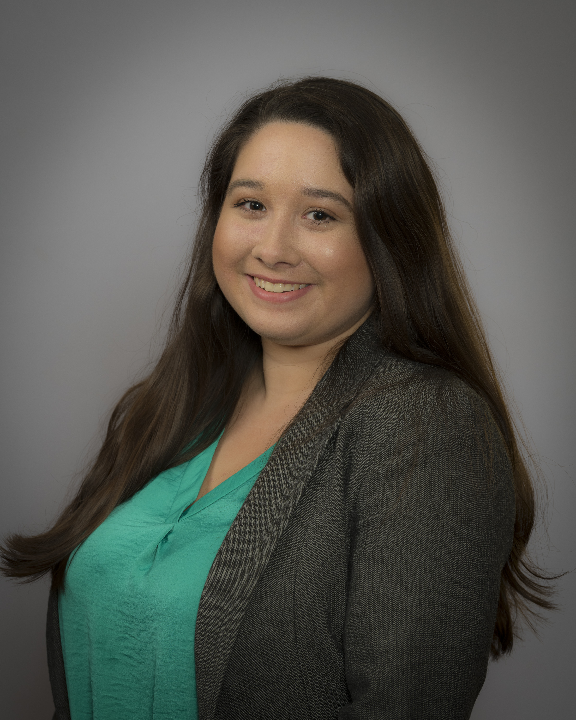 Portrait of Ericka Bruske on a dark gray background