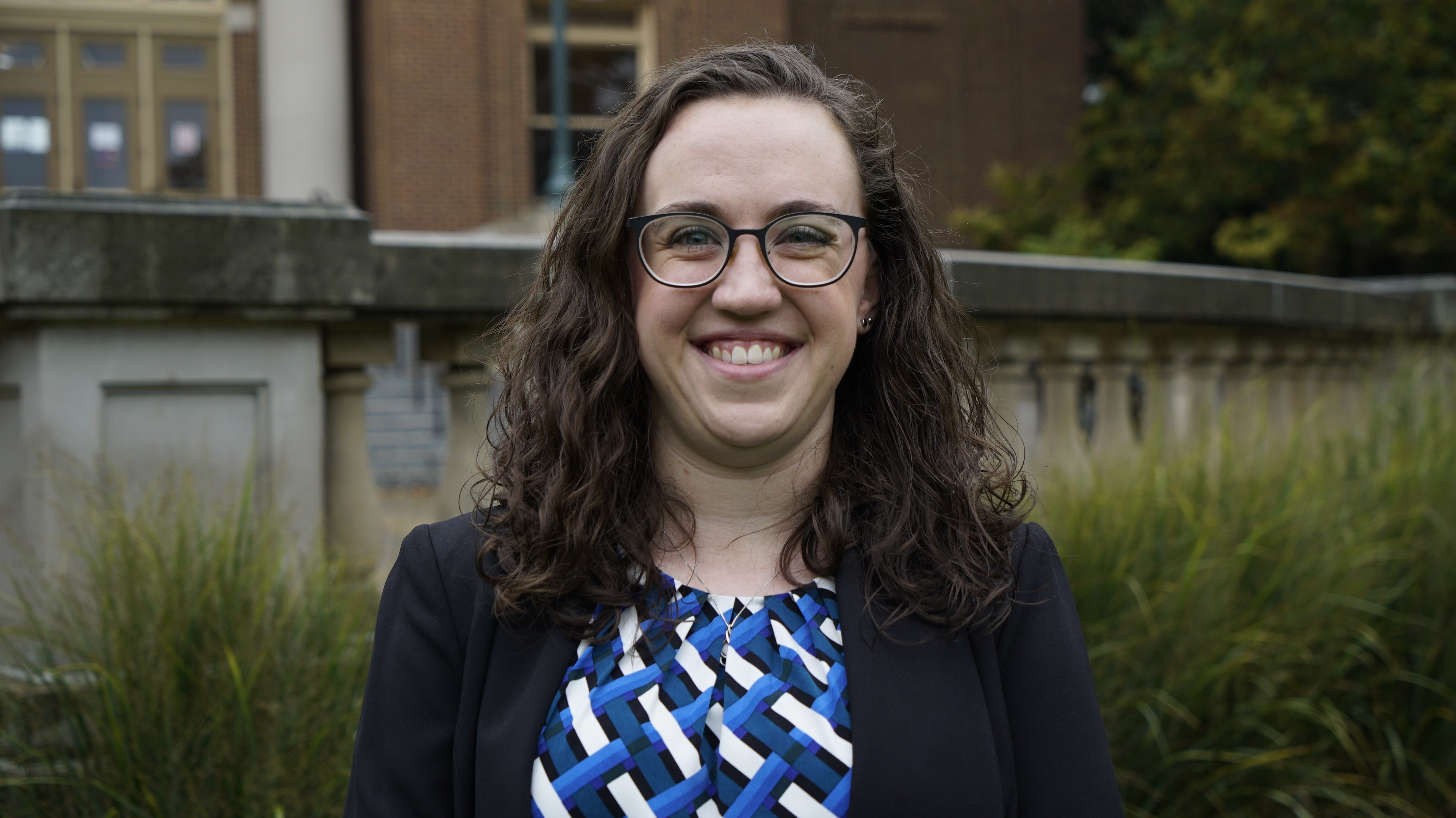 Portrait of Sophie McClain standing in an outdoor setting