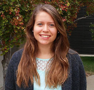 Portrait of Emily Geddes standing in an outdoor setting