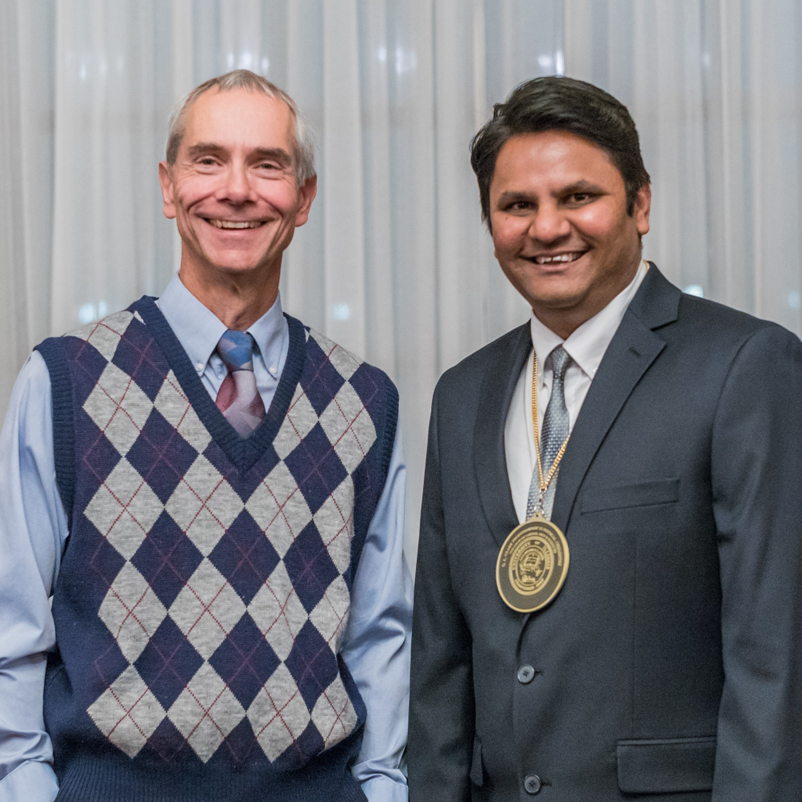 Portrait of Martin Gruebele and Prashant Jain standing side by side