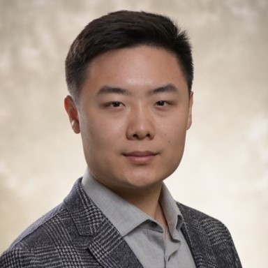 Head shot of Richard Xie on a tan background