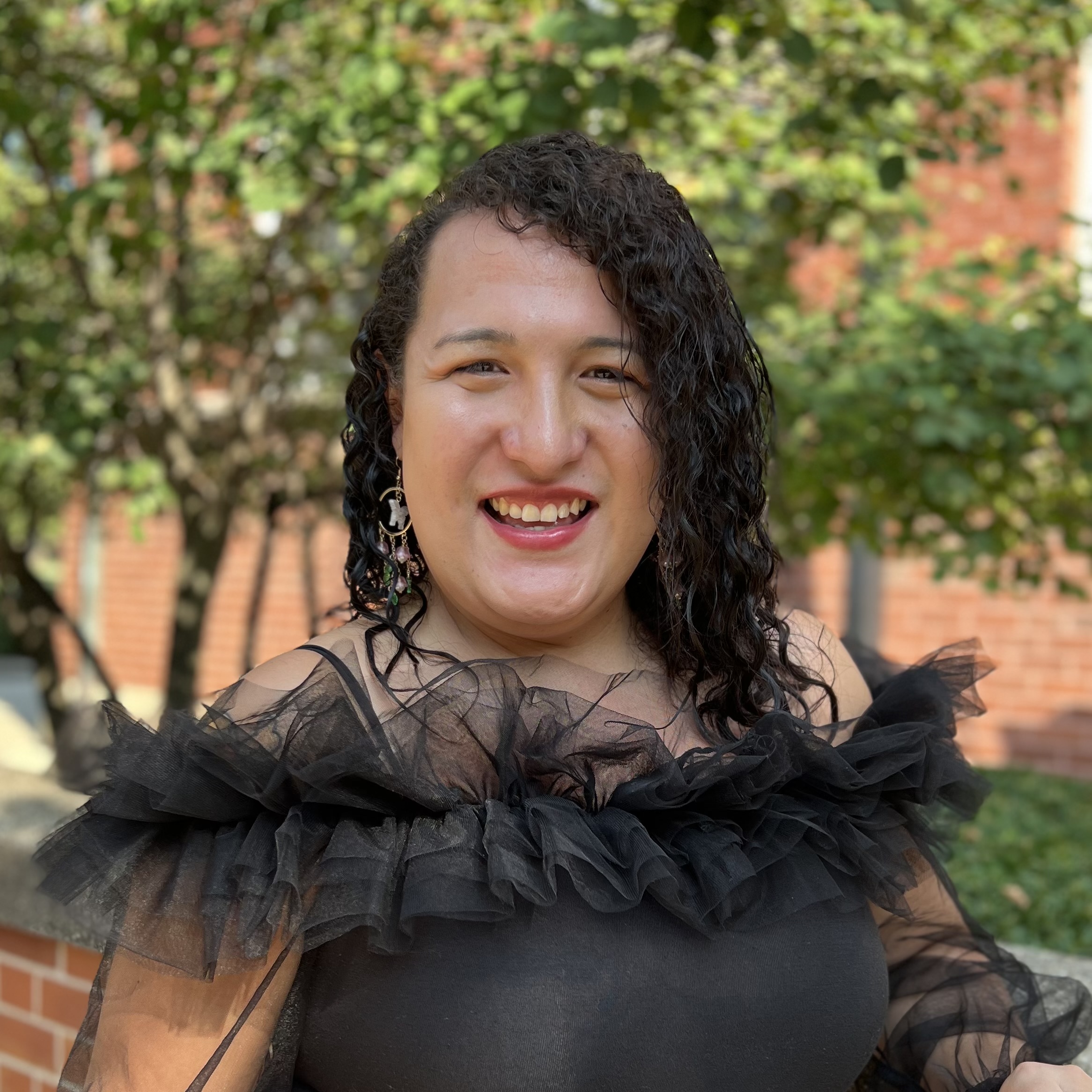 Portrait of Raylene Gomez Hernandez with an outdoor background