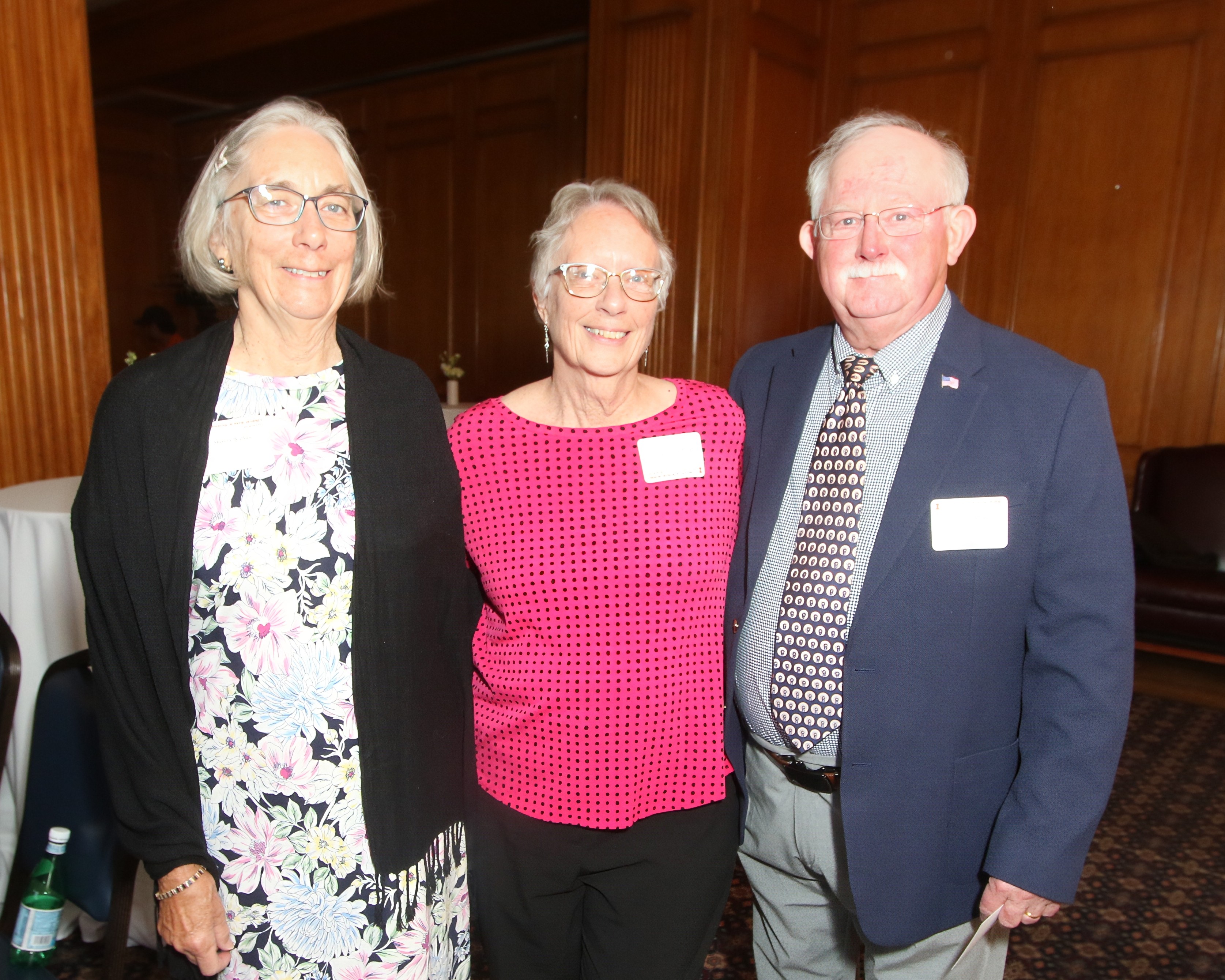 Three people standing side by side