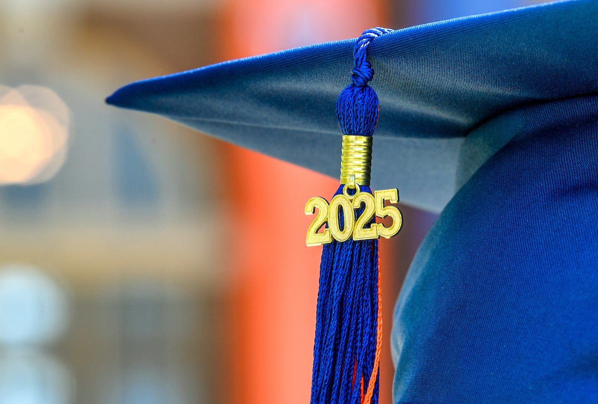 Tassle hanging from a graduation cap with the year 2025