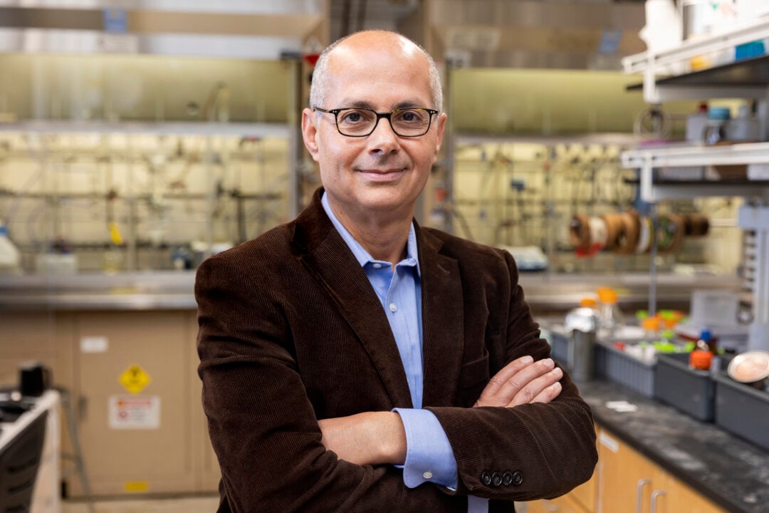 Omar Yaghi standing with arms crossed in a lab