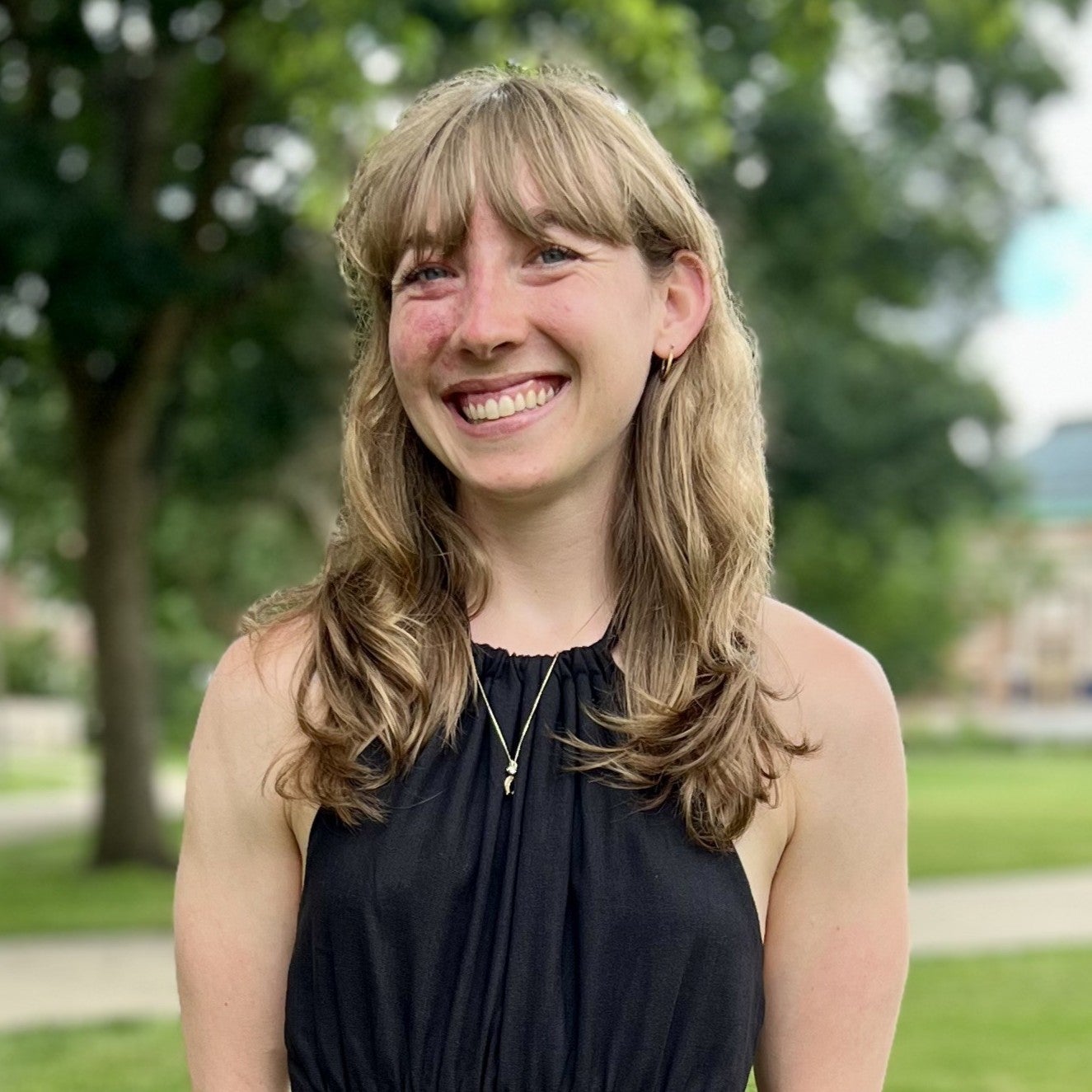 Portrait of Rachel Schaaf standing in the University of Illinois quad