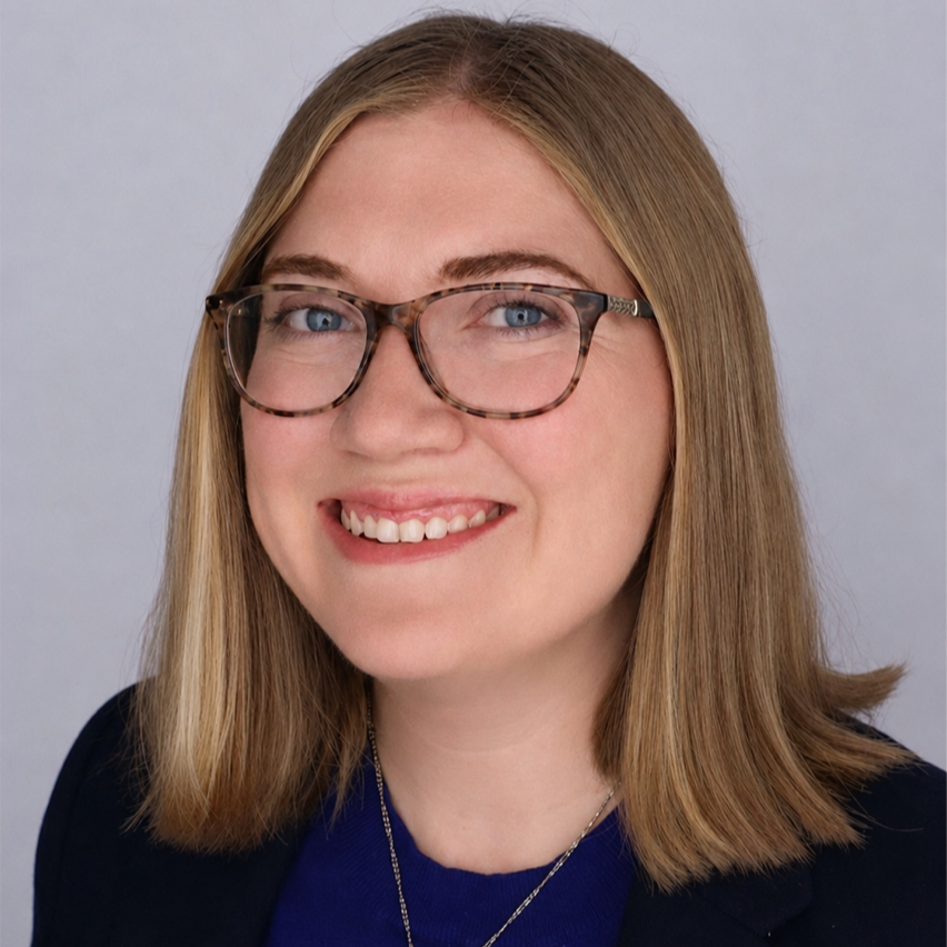 Head shot of Megan Steves on a light gray background