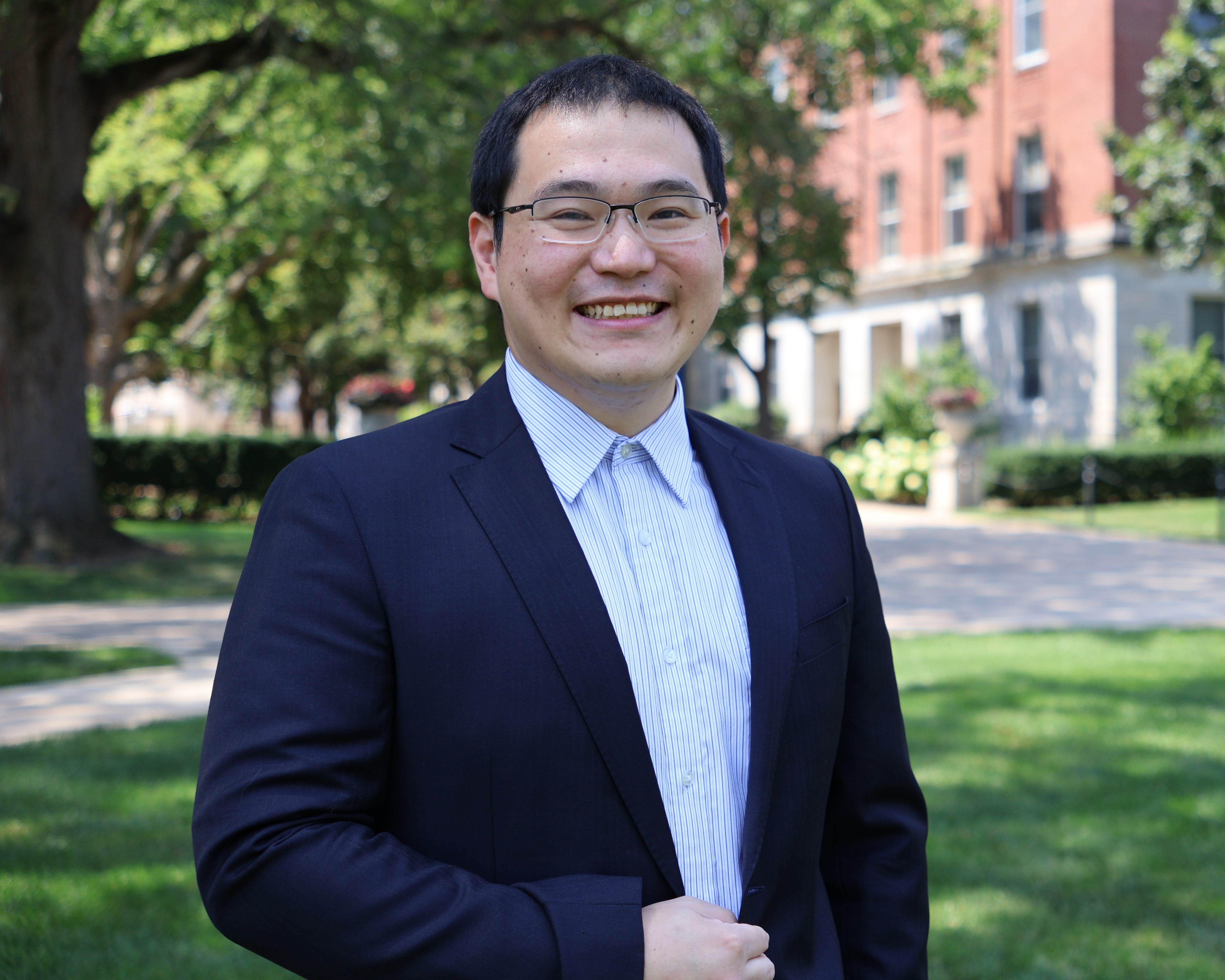 Portrait of Liwei Zheng outdoors on campus