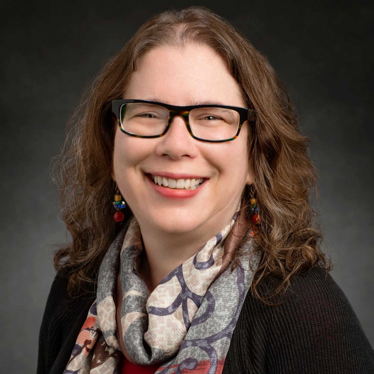 Head shot of Catherine J. Murphy on a dark gray background