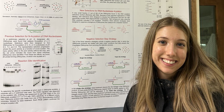 Head shot of Maria Massa in front of a research poster