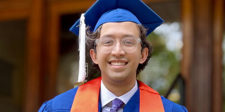 Head shot of Vinny Pillai in a graduation cap