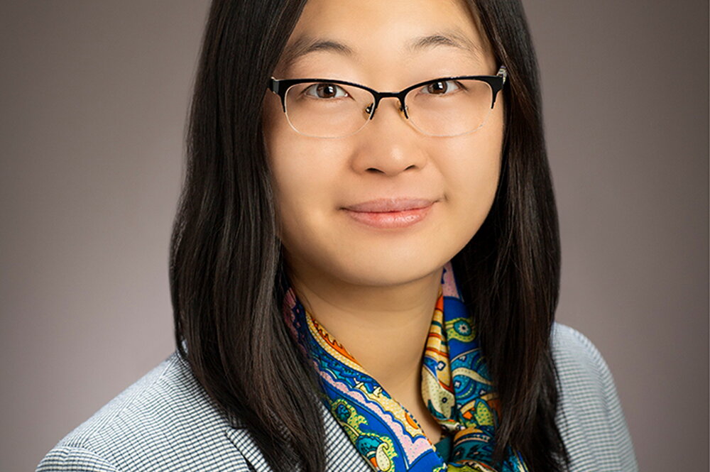 Head shot of Ying Diao on a tan background