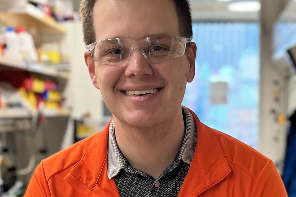 Mike Strauss headshot with safety glasses in lab setting