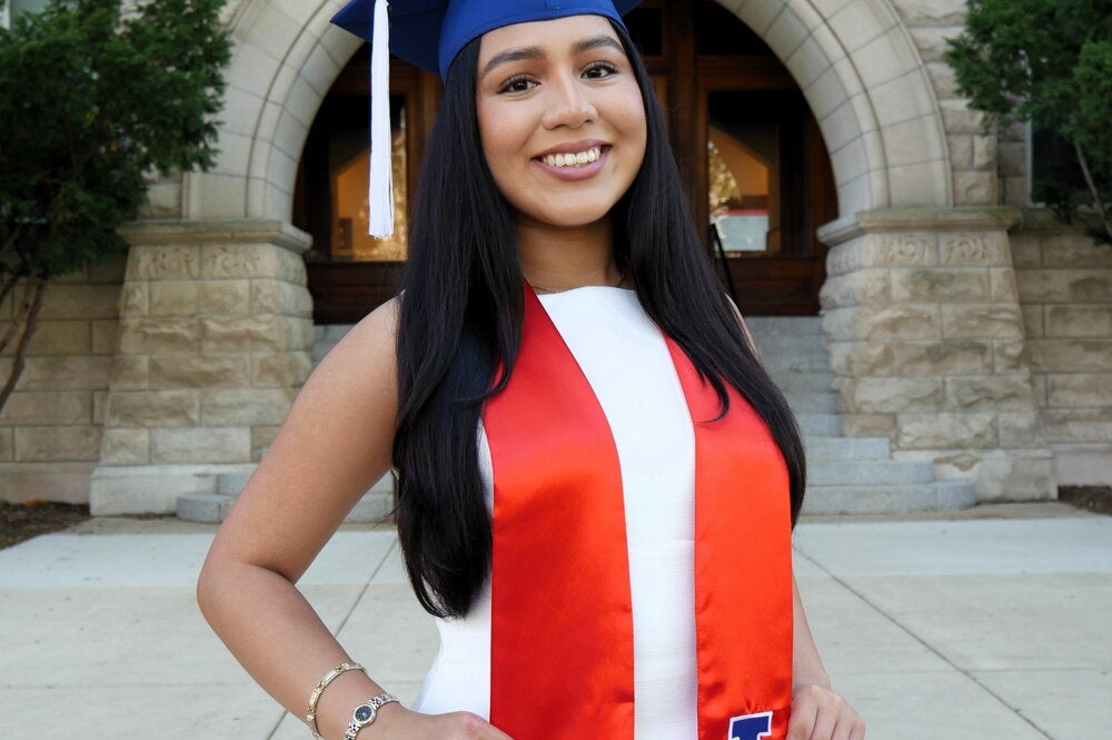 student in graduation regalia