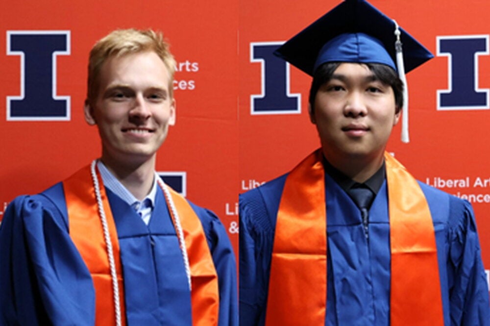 Strand and Yang in graduation regalia on an orange Block I background 