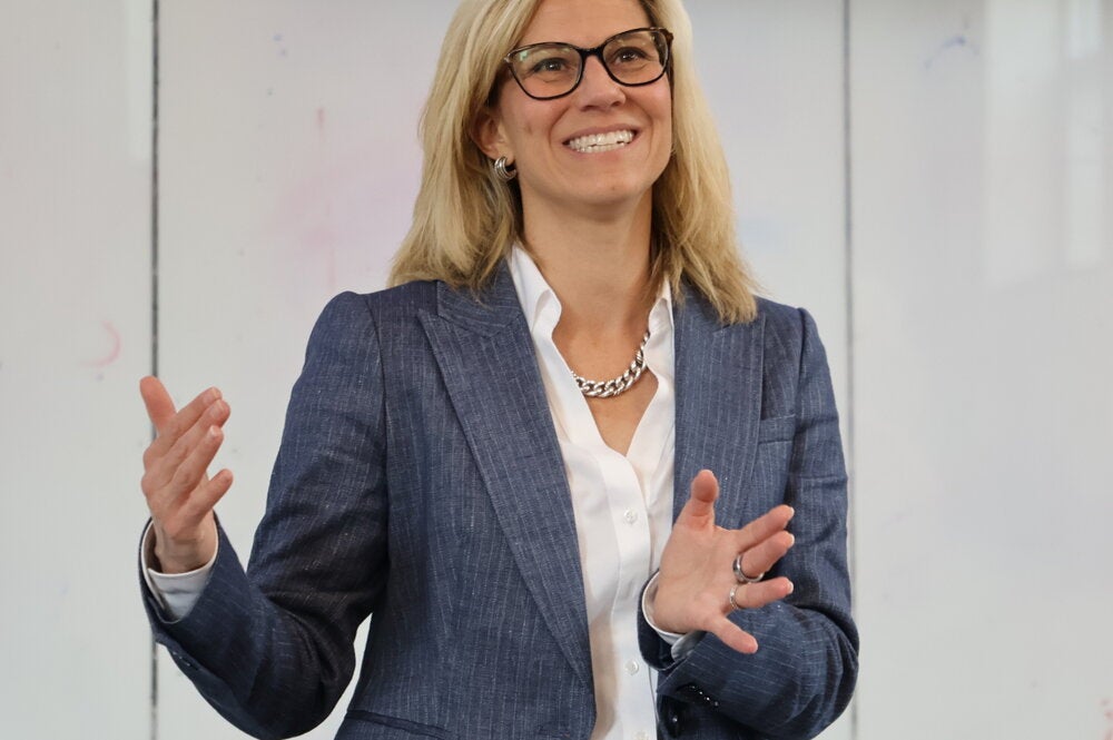 Stephanie Potisek Lee standing at the front of a classroom talking