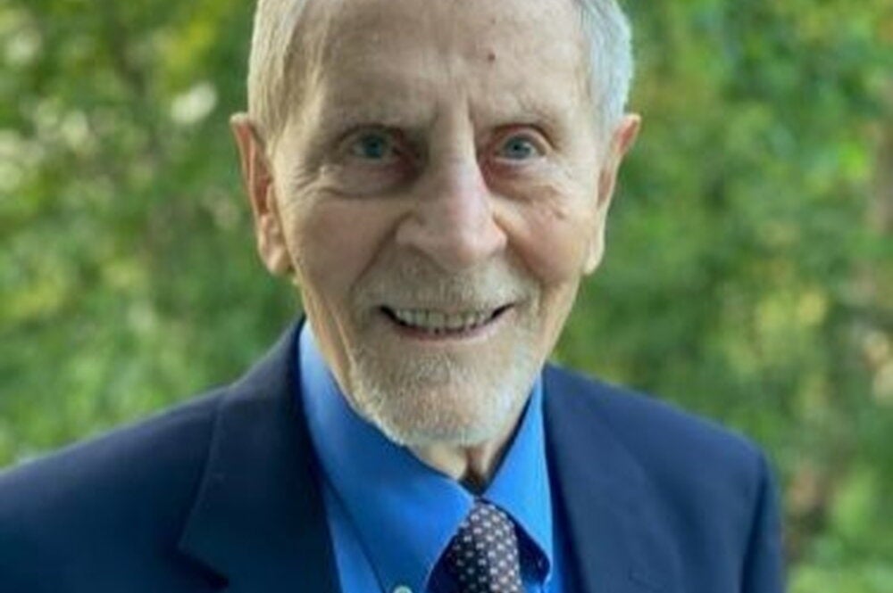 Head shot of Ted Brown in front of trees