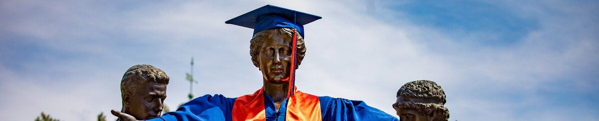 Alma Mater in graduation regalia