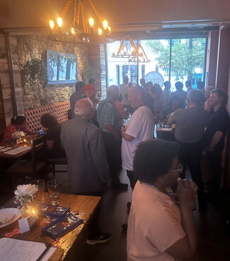 Group of people standing in a restaurant