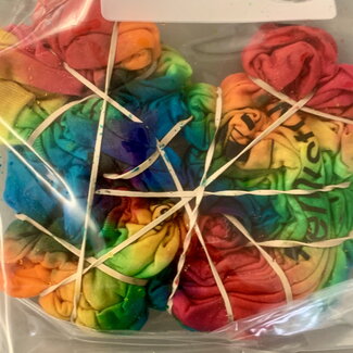 bag filled with tie dyed shirts