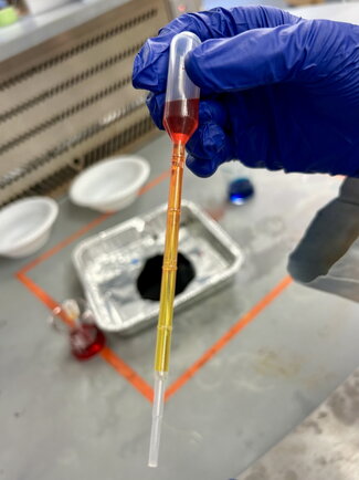 thin glass tube with colored liquids