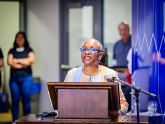 Venetria K. Patton speaking at a podium