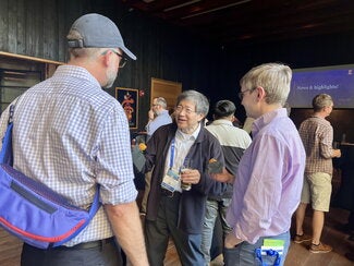 Three reception guests talking during the event