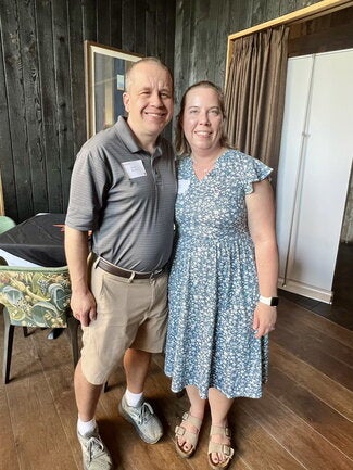Reception guests pose for a photo. 