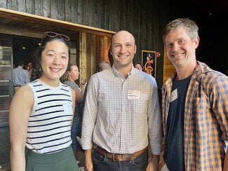 Three reception guests standing together