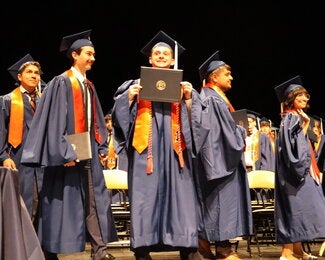 Graduate holding diploma 