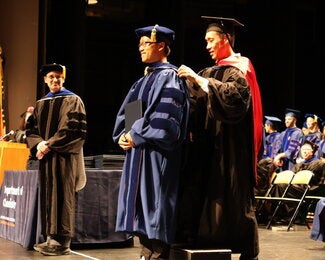 Graduate getting hooded