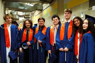 Graduates standing together side by side