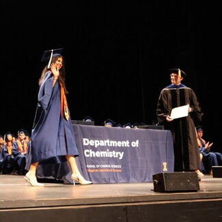 Graduate walking across stage