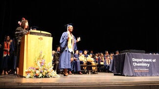 Graduate walking across stage