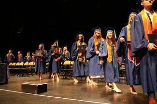 Graduates leaving the stage