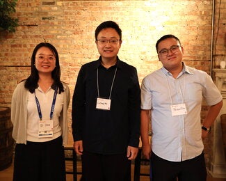 Three people standing together 