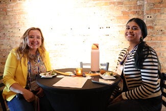 Two people sitting at a table