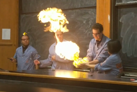 Chemistry students do a Holiday Magic chemistry demonstration with fire