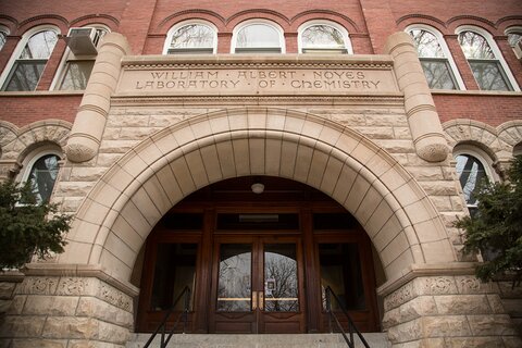 Photo focused on the stone arch in the main entrance to Noyes Lab.
