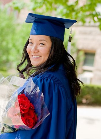 girl with roses in cap and gown