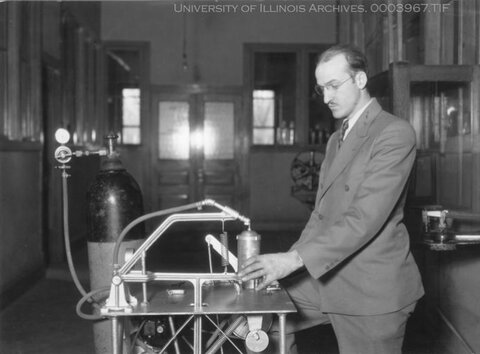 Black and white photos in the 1930s showing Charles Gets in a suit in the lab demonstrating equipment that produces whip cream in a can.