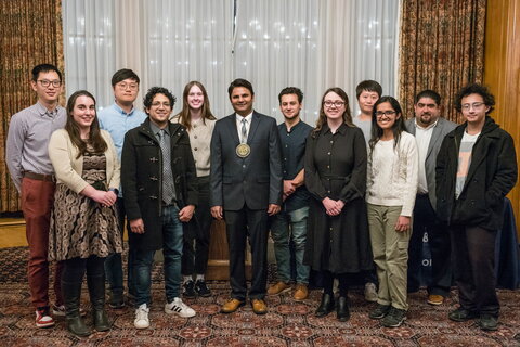 Prashant Jain stands with members of his research group.