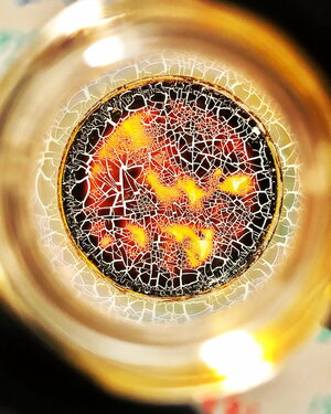 Image of a thin, cracked polymer film resembling a stained-glass mosaic
