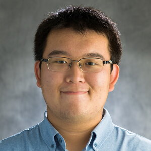 Head shot of Yichen Li on a gray background
