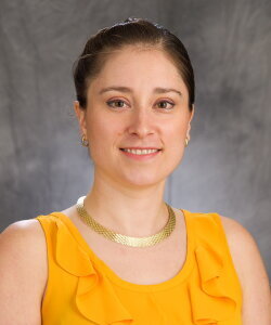Head shot of Jordan Axelson on a brown background