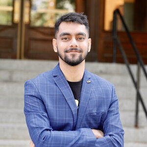 Head shot of Suritra Bandyopadhyay in front of Noyes steps