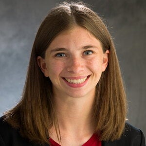 Head shot of Leah Stroebel in a gray background