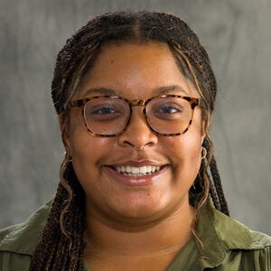 Head shot of Kristin Martin on a gray background