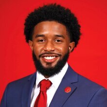 Head shot of Jalen Spain on a red background